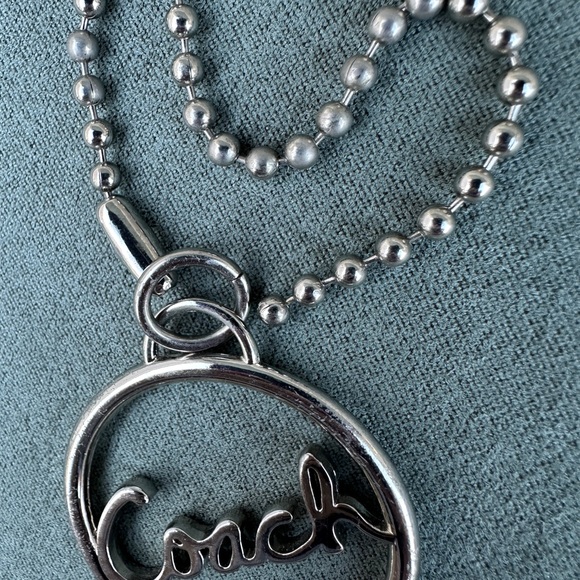 Coach Circular Silver Keychain
Coach Silver Circle Keychain – Timeless Elegance - Picture 5 of 16